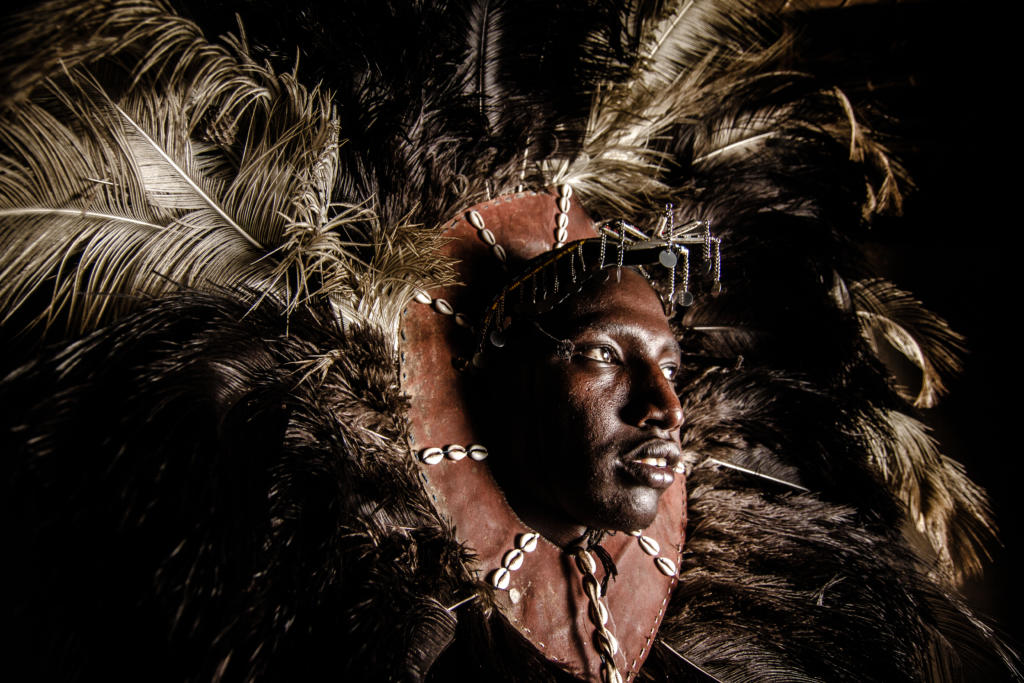 Maasai moran (warrior) in traditional ostrich feather headdress, Kenya