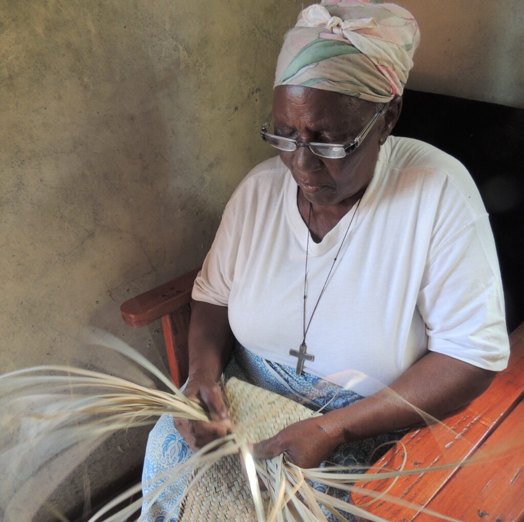 Mrs Mwazeima making reed mats which Tikondane (Zambia) sell in their shop